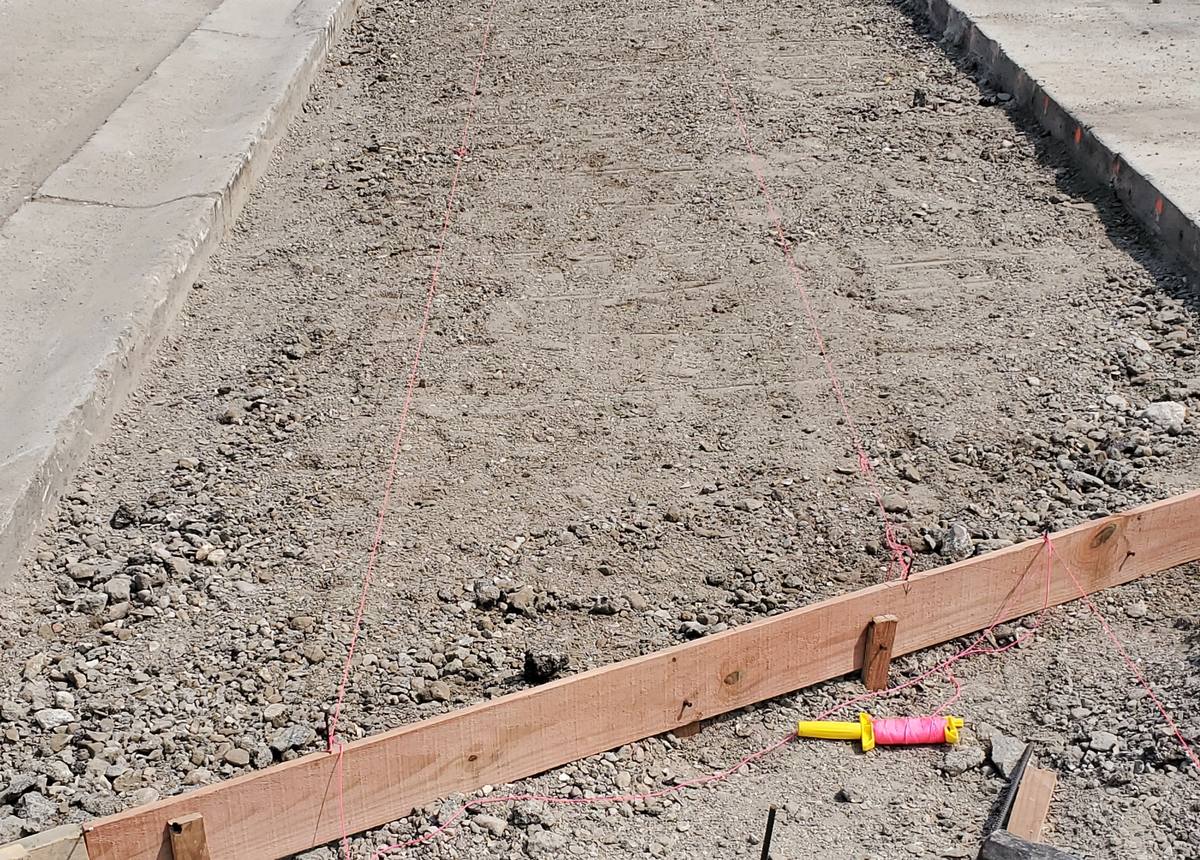 Sidewalk forms and rebar set before a concrete pour